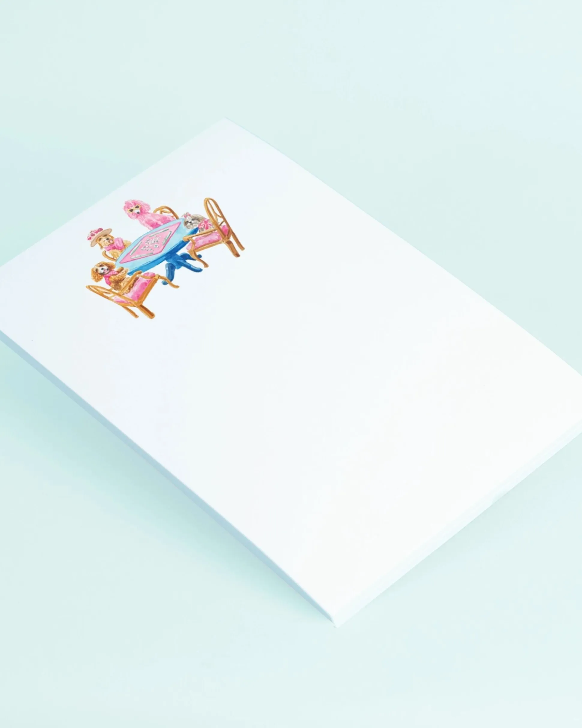 Dogs Playing Mahjong Notepad in White